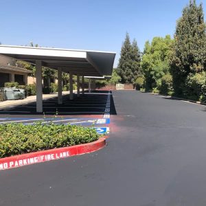 HOA common parking lot that has been seal coated and striped