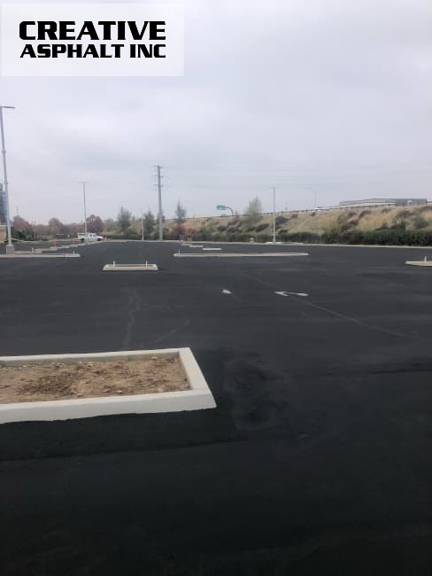 The parking lot has been upgraded with freshly applied sealcoating and newly added stripes.