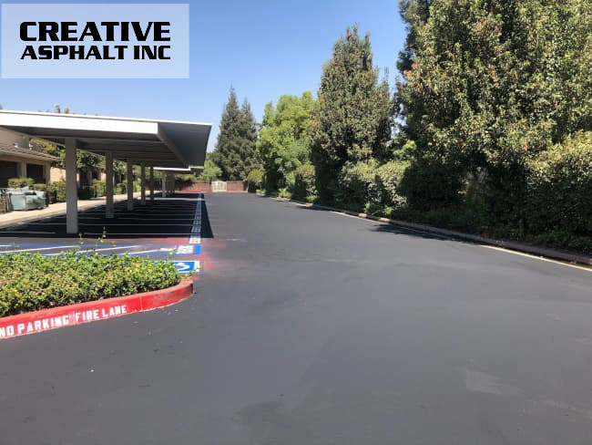 The parking lot has been given a face-lift with a new coat of sealcoating and crisp striping.