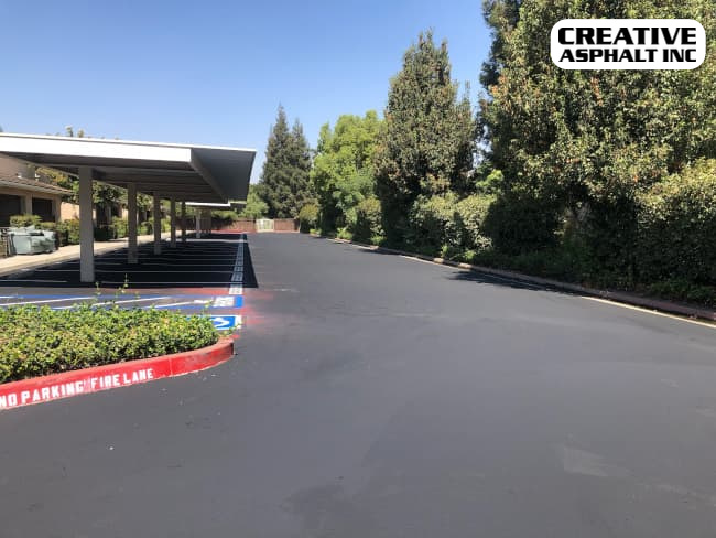 HOA driveway with new sealcoating and striping