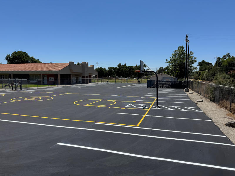 asphalt playground with new sealcoating and lines