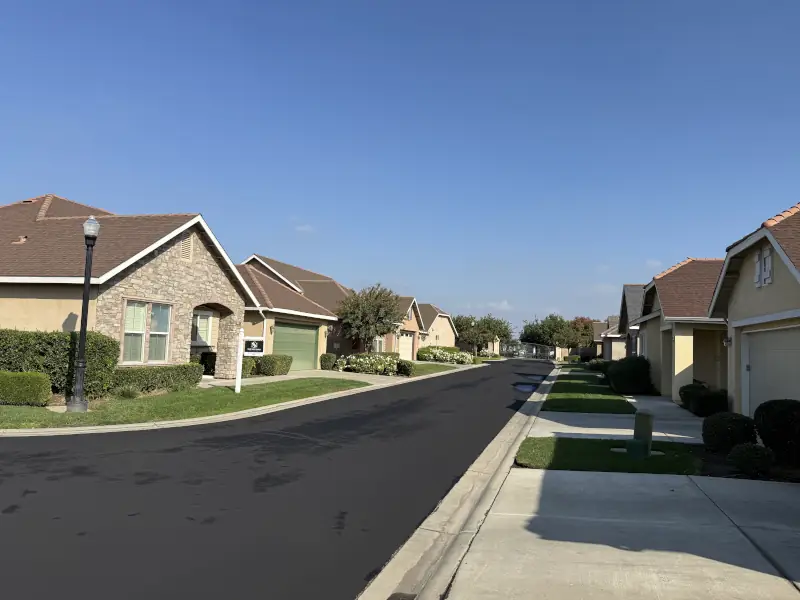 Sealcoating drying on asphalt